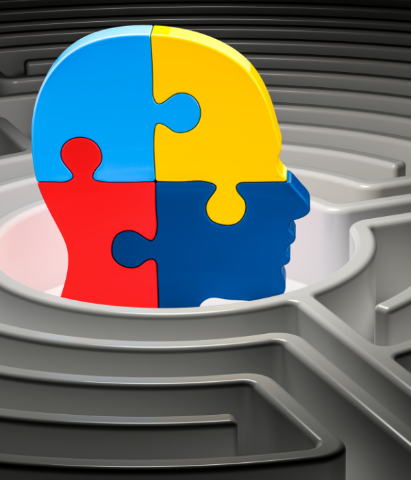 An illustration of colorful puzzle pieces resembling a human head